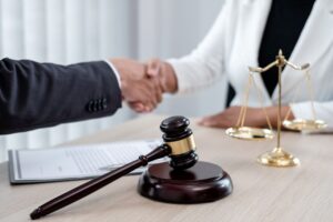Attorney and Client shake hands
